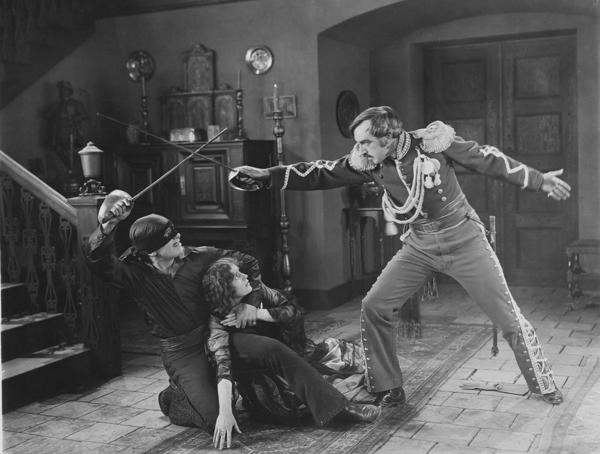 An early inspiration: Douglas Fairbanks defends the oppressed people in the silent film THE MARK OF ZORRO.